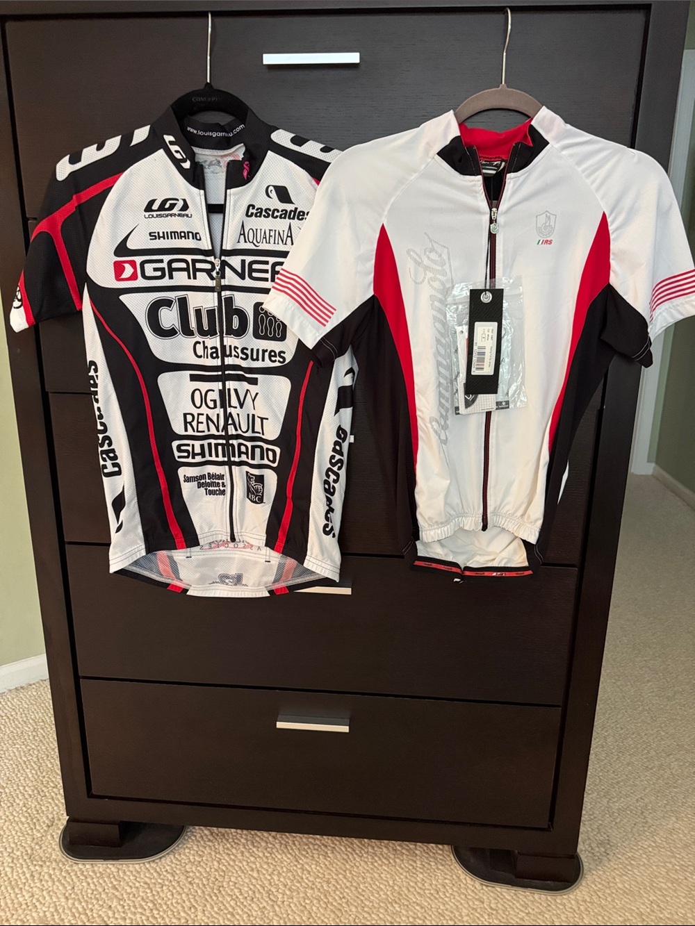Two size small cycling jerseys.